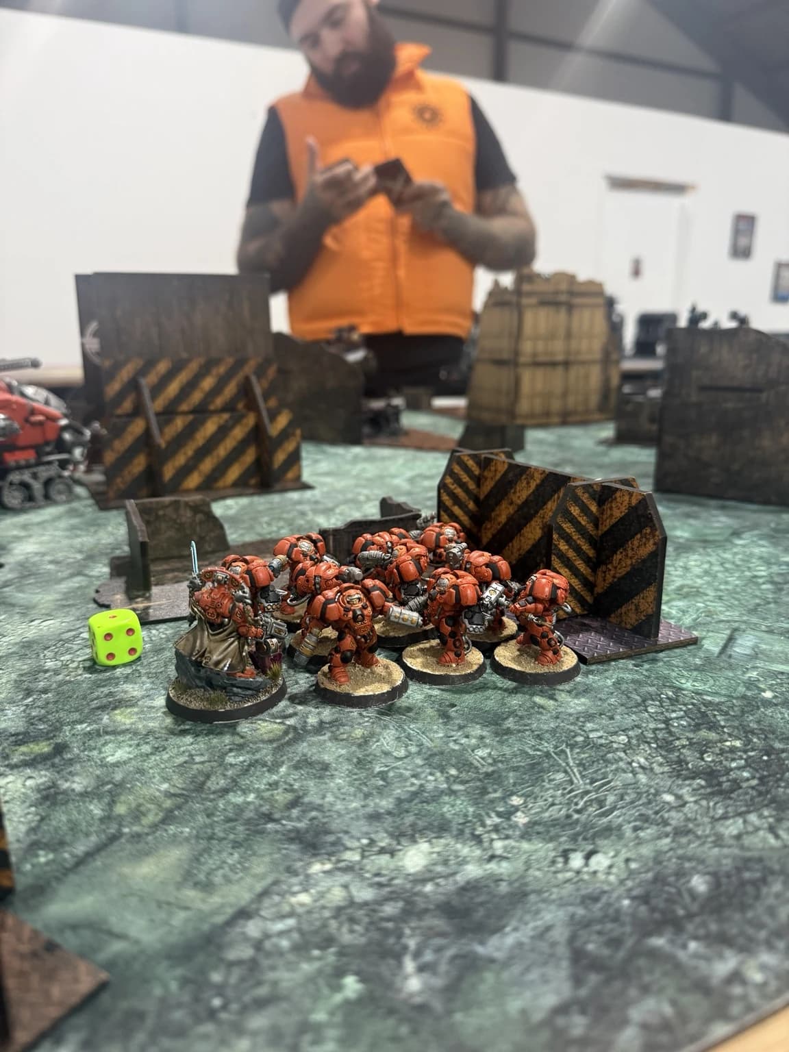 Orange Hearthguard grouped beside a short ruin during the game